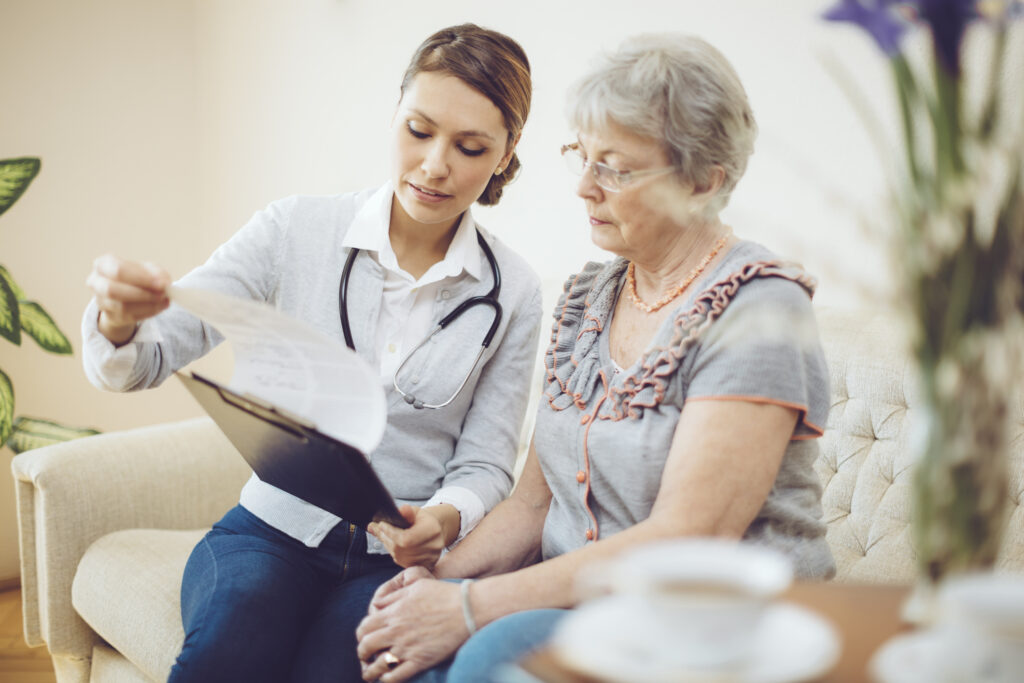 Hospital staff reviewing paperwork with patient